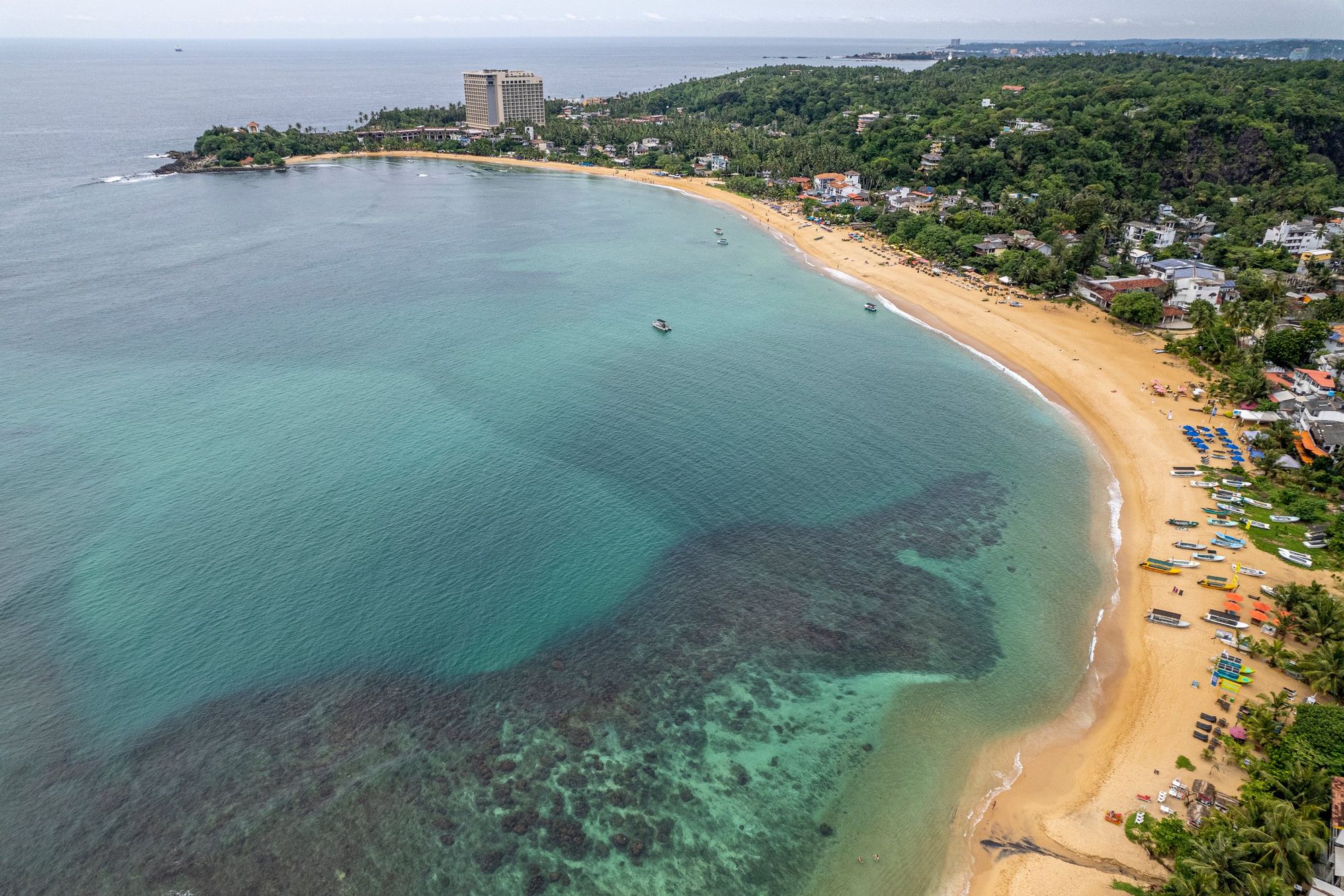 Mirissa from the air: a curved beach and turquoise water